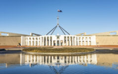 The national flag flutters on the Parliament House, Canberra, Australia.