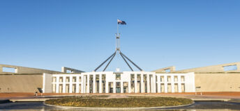 The national flag flutters on the Parliament House, Canberra, Australia.