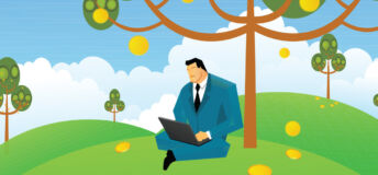businessman with laptop under a tree