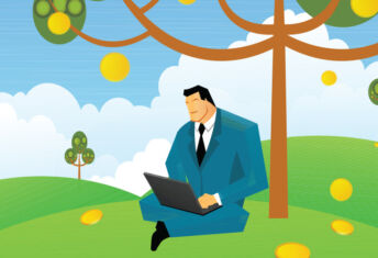 businessman with laptop under a tree