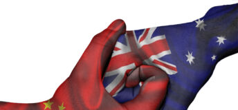 Diplomatic handshake between countries: flags of China and Australia overprinted the two hands