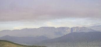 Buckland Valley in autumn with Mount Buffalo in the background on a smokey morning