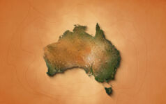 The video showcases an animation of a realistic map of Australia set against a brown vintage paper background. It utilizes a zooming effect, allowing viewers to closely examine the continent, revealing its geographical features and details.