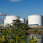 IFM Investors extends decision on Australian renewable fuels facility A Qantas Airbus A380-842 plane, registration VH-OQG, taking off to the north from Sydney Kingsford-Smith Airport as flight QF1 to London via Singapore. In the foreground are the airport's fuel storage tanks and Alexandra Canal. On the banks of the canal is a wattle tree. The wattle is the national flower of Australia. This image was taken from Tempe Recreational Reserve on a cold and sunny afternoon on 27 July 2024.