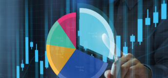 Image of a person pointing at a pie chart.